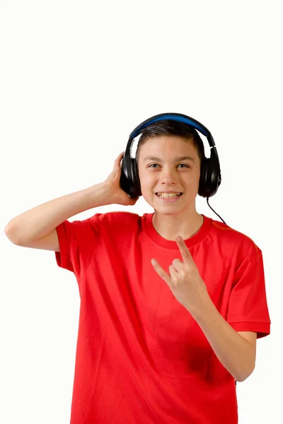 Young caucasian teenage boy listening to music — Stock Photo, Image