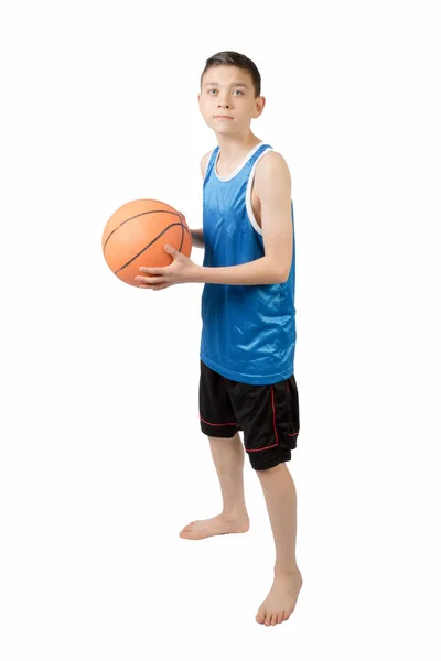 Young caucasian teenage boy with a basketball Stock Picture