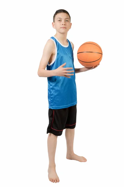 Young caucasian teenage boy with a basketball Stock Photo
