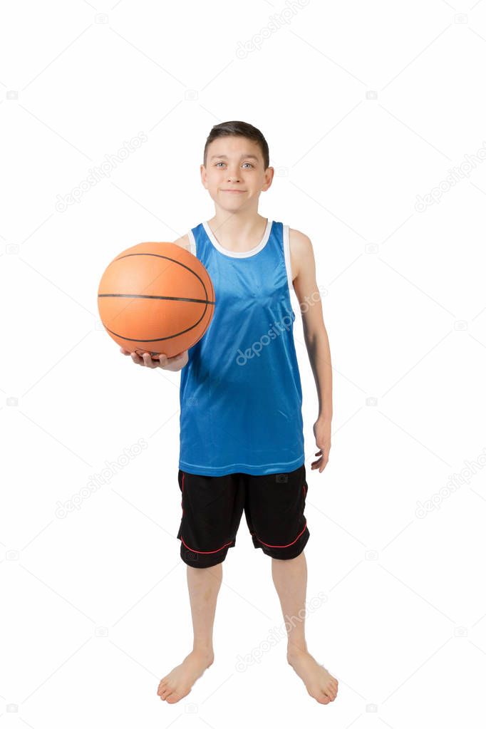 Young caucasian teenage boy with a basketball