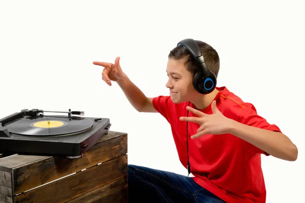 Young caucasian teenage boy listening to music — Stock Photo, Image