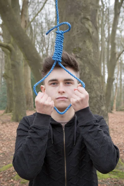 Depressed teenage boy with a hangman's noose — Stock Photo, Image