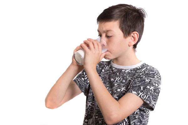 Young teenage boy with a milk moustache after drinking milk — Stock Photo, Image