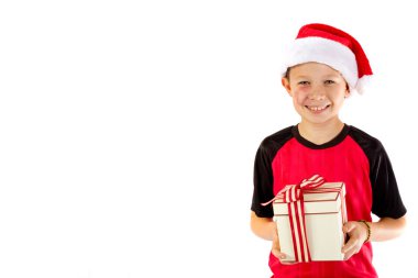 Pre-teen boy with a christmas gift clipart