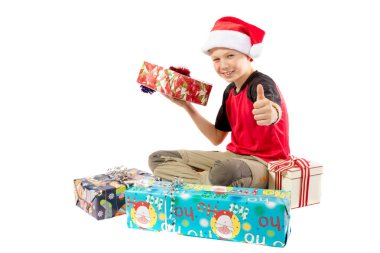 Pre-teen boy and a selection of Christmas gifts clipart