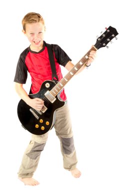 Pre-teen boy and an electric guitar clipart