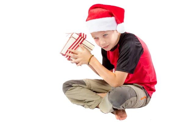 Pre-teen boy with a christmas gift — Stock Photo, Image