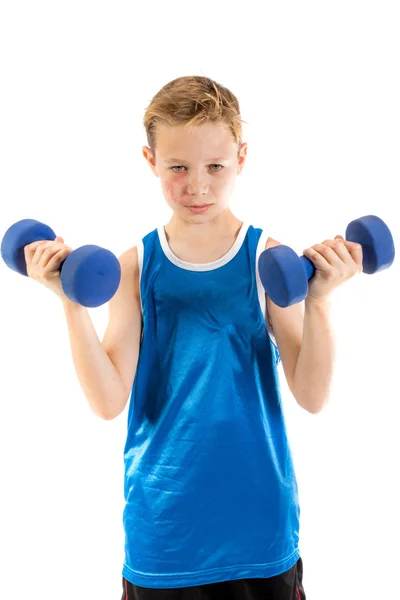 Pre-teen boy lifting weights — Stock Photo, Image