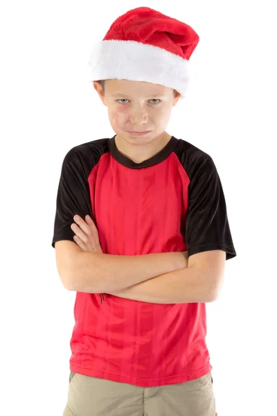 Pre-adolescente niño usando un sombrero de santa —  Fotos de Stock