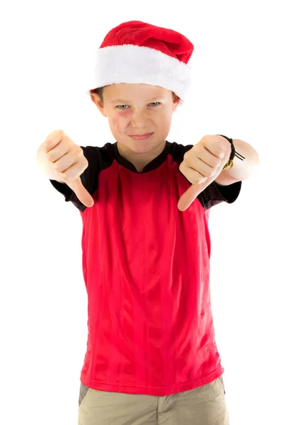 Pre-adolescente niño usando un sombrero de santa —  Fotos de Stock