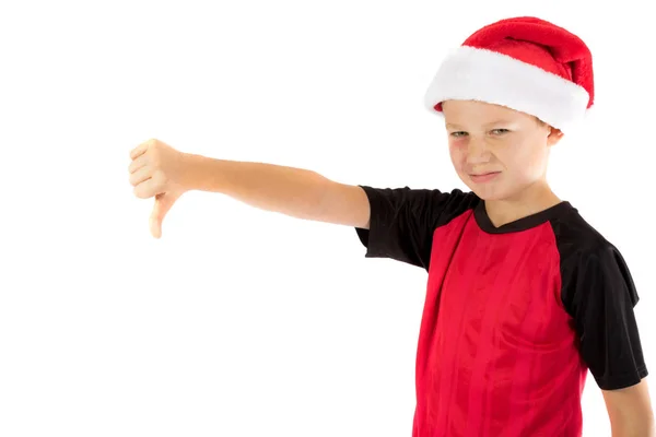 Menino pré-adolescente usando um chapéu de Pai Natal — Fotografia de Stock