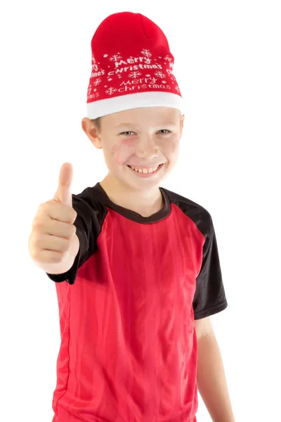 Menino pré-adolescente usando um chapéu de Pai Natal — Fotografia de Stock