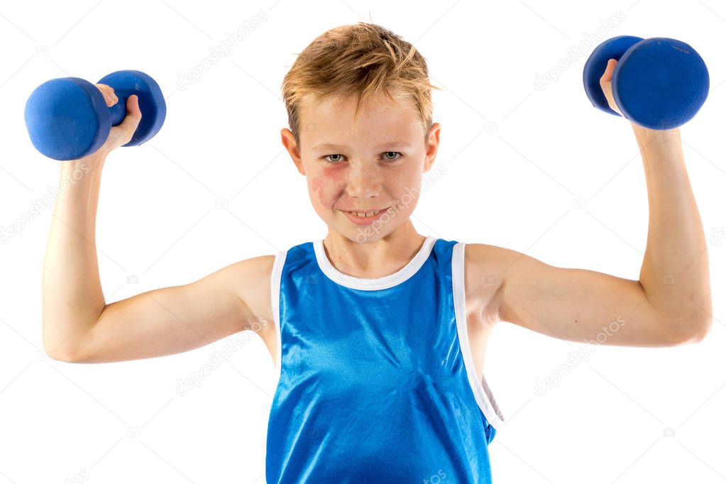 Pre-teen boy lifting weights