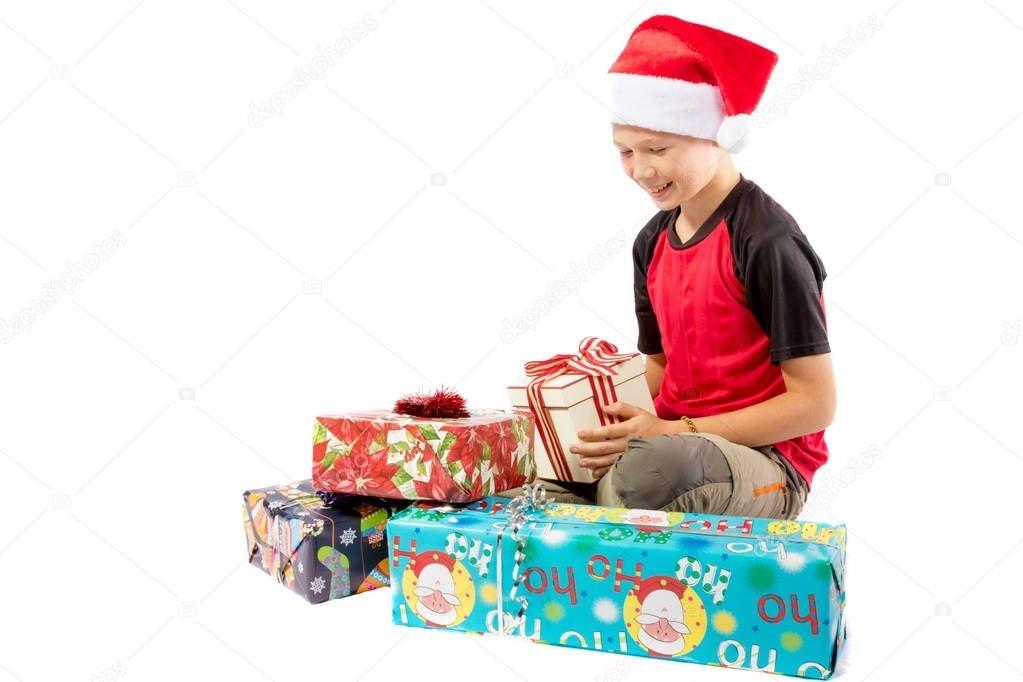 Pre-teen boy and a selection of Christmas gifts