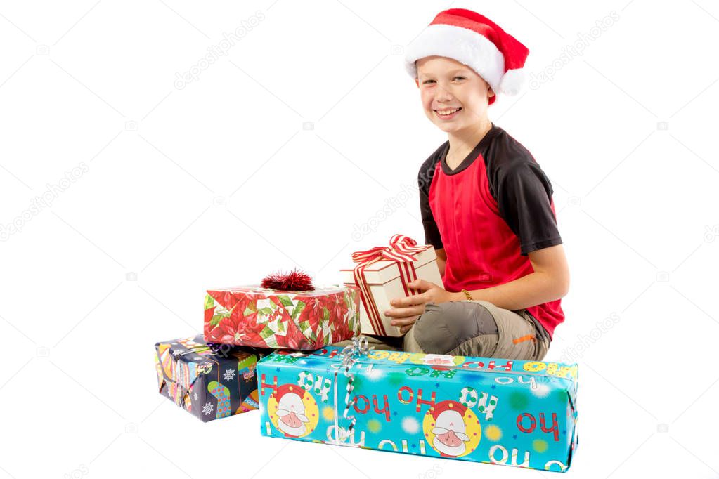 Pre-teen boy and a selection of Christmas gifts