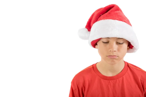Rapaz adolescente triste usando um chapéu de Natal — Fotografia de Stock