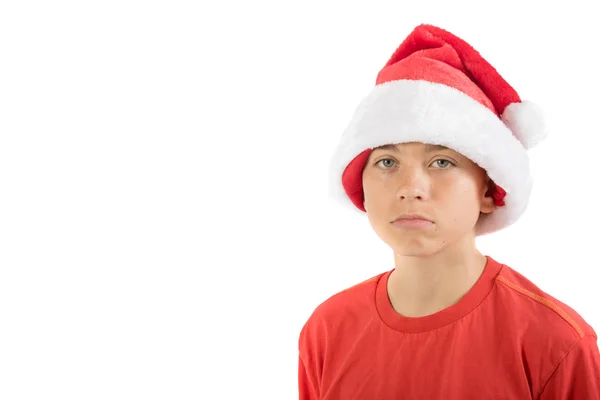 Szomorú tizenéves fiú karácsonyi kalapban — Stock Fotó