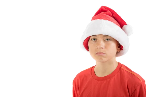 Rapaz adolescente triste usando um chapéu de Natal — Fotografia de Stock