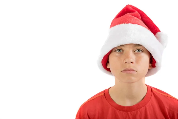 Szomorú tizenéves fiú karácsonyi kalapban — Stock Fotó