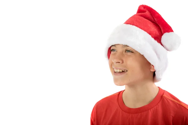 Menino adolescente feliz usando um chapéu de Natal — Fotografia de Stock