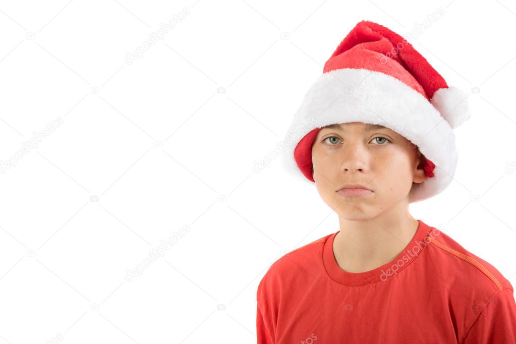 Sad teenage boy wearing a Christmas hat
