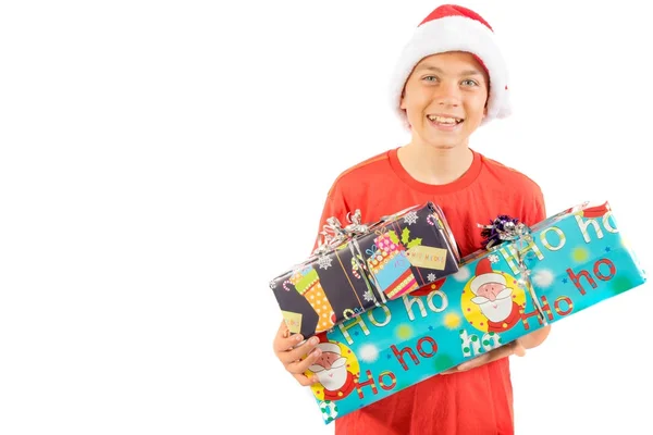 Ung tonårspojke hatt Santa Jul med en gåva — Stockfoto