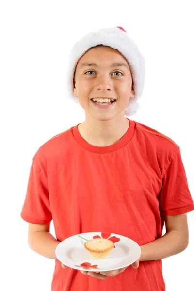 Adolescente menino isolado no fundo branco com um mince pie — Fotografia de Stock