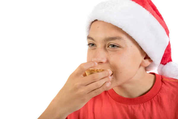 Adolescente menino isolado no fundo branco com um mince pie — Fotografia de Stock