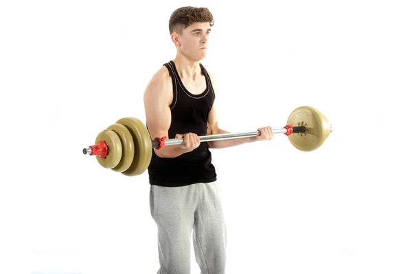 Adolescente de 18 años haciendo ejercicio con pesas —  Fotos de Stock