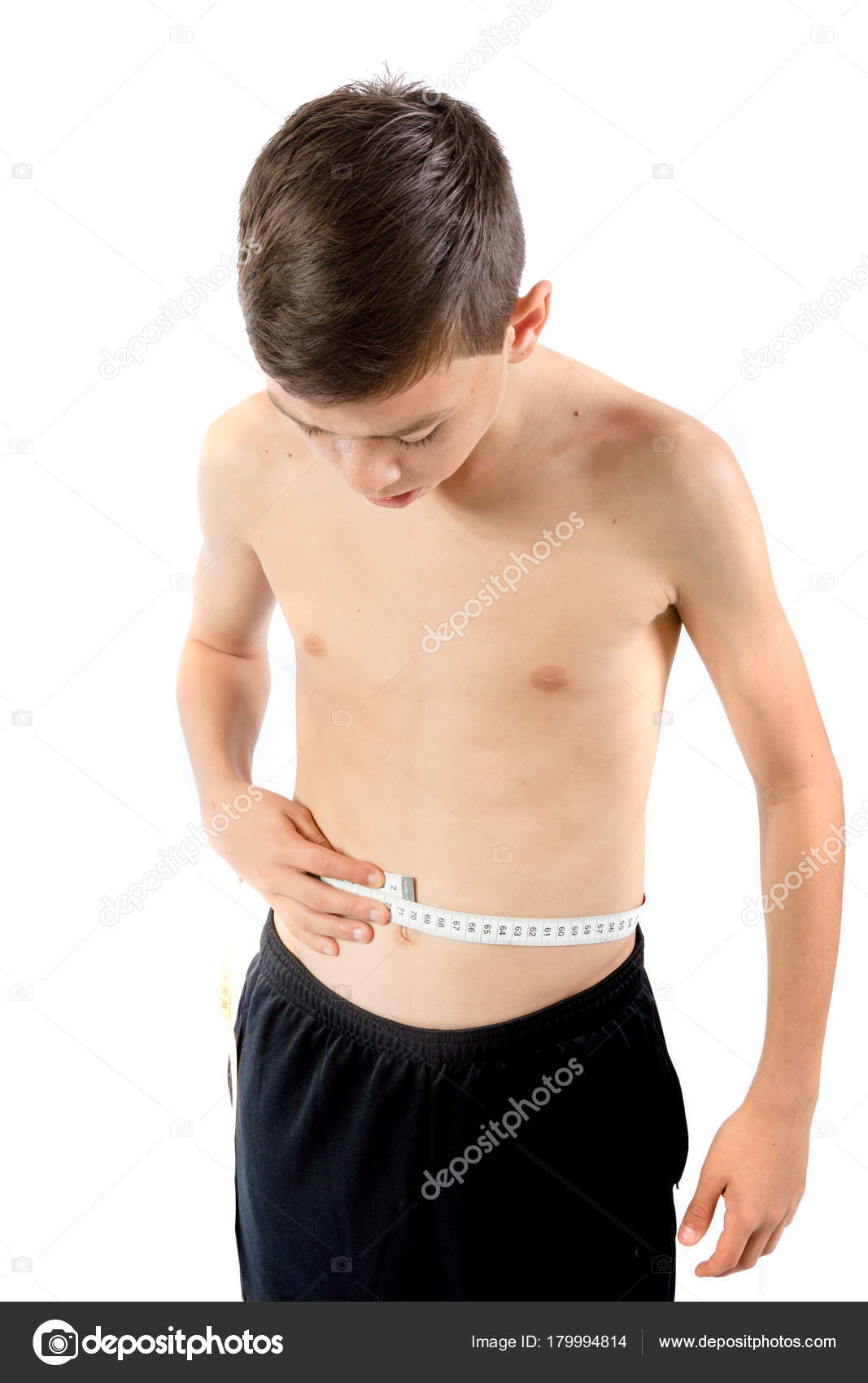 Teenage boy measuring his waist — Stock Photo © Triumph0828 179994814