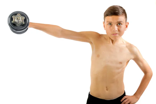 10 代の少年のダンベル運動 — ストック写真