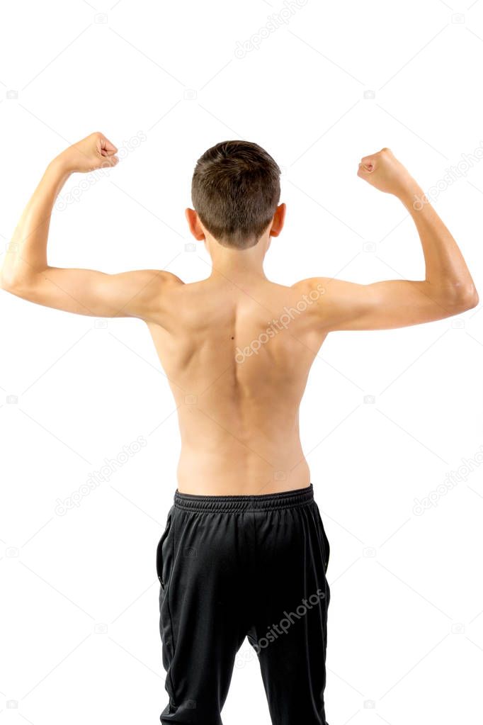 Shirtless teenage boy flexing his back muscles
