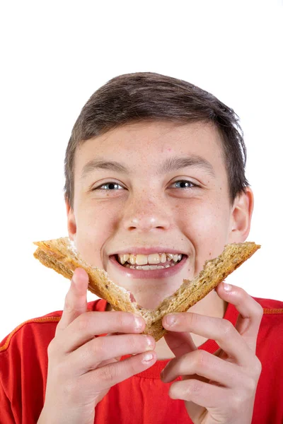 Jonge Kaukasische tiener met een boterham — Stockfoto