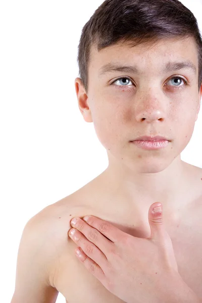 Young caucasian teenage boy who has hurt his shoulder — Stock Photo, Image