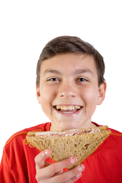 Kaukázusi fiatal tizenéves fiú, egy szendvics — Stock Fotó