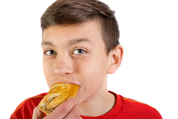 Jovem caucasiano adolescente com um rolo de salsicha — Fotografia de Stock