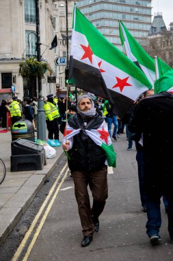 Suriye Cumhurbaşkanı Esad protestocular Londra'nın merkezinde Mart.