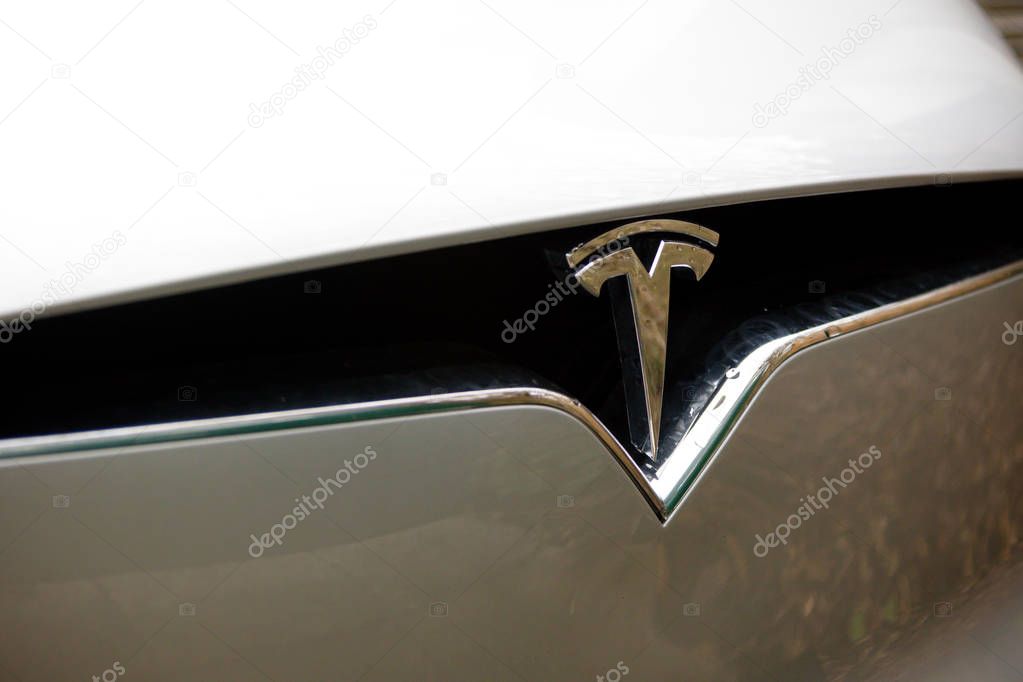 Reading, United Kingdom, 31th March 2018: A Tesla charges at the Tesla Supercharger station at Readings Green Park. Superchargers allow for rapid charging compared to home charging.