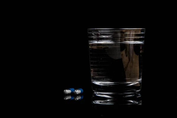 Medical pills isolated on a black background — Stock Photo, Image