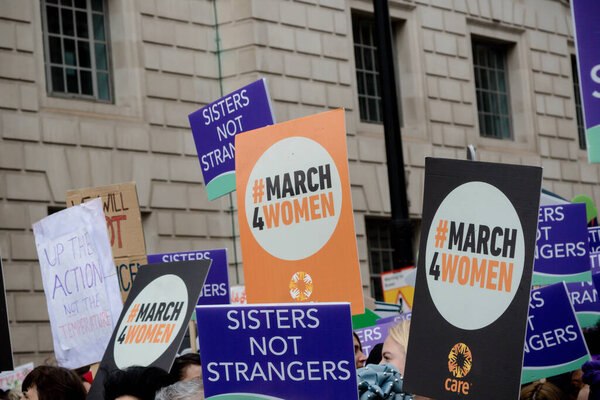 London, United Kingdom, March 8th 2020: - The March For Women hosted by Care International. На фотографии вывески марширующих
