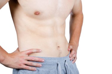 Kilo verme kavramı, kaslı, genç bir yetişkinin eşofman giydiğini gösteriyor.