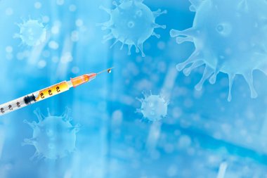 Coronavirus aşısı kavramı, mavi arka planda şırınga