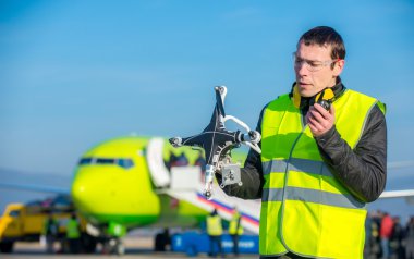 airport worker with crashed drone clipart