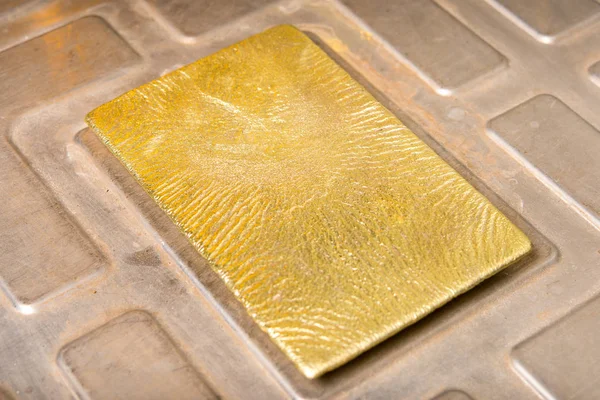 Shiny golden ingot — Stock Photo, Image