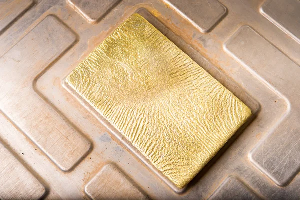 Shiny golden ingot — Stock Photo, Image