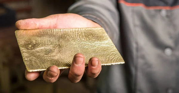 Shiny golden ingot — Stock Photo, Image