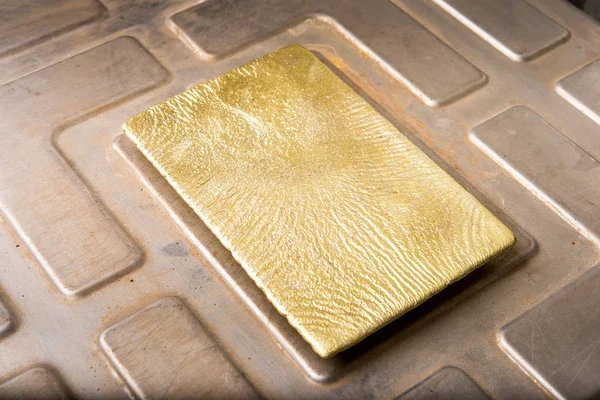 Shiny golden ingot — Stock Photo, Image