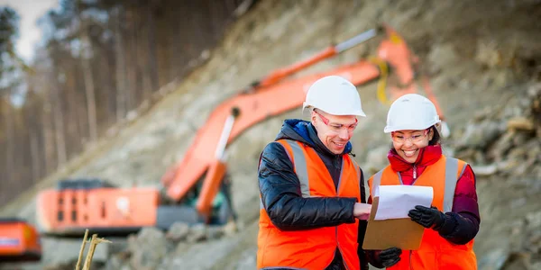 Road workers inspecting construction — Stock Photo, Image