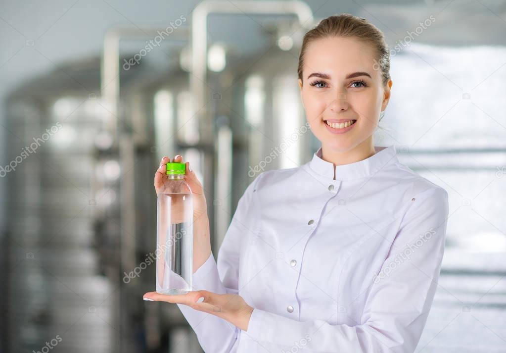 Specialist with bottle of pure water