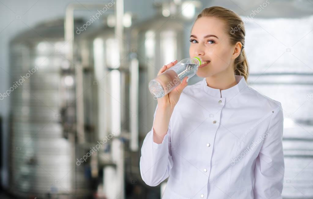 Specialist with bottle of pure water